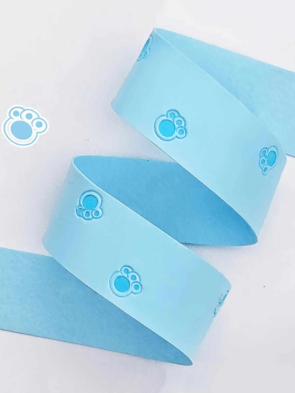 Light blue Paw Print Sports Overgrip Tape for Racket Handles - SF3460 with cute paw designs, perfect for tennis and racket sports.